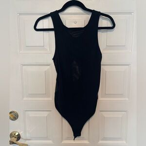 Black body suit with mesh and cut out detailing